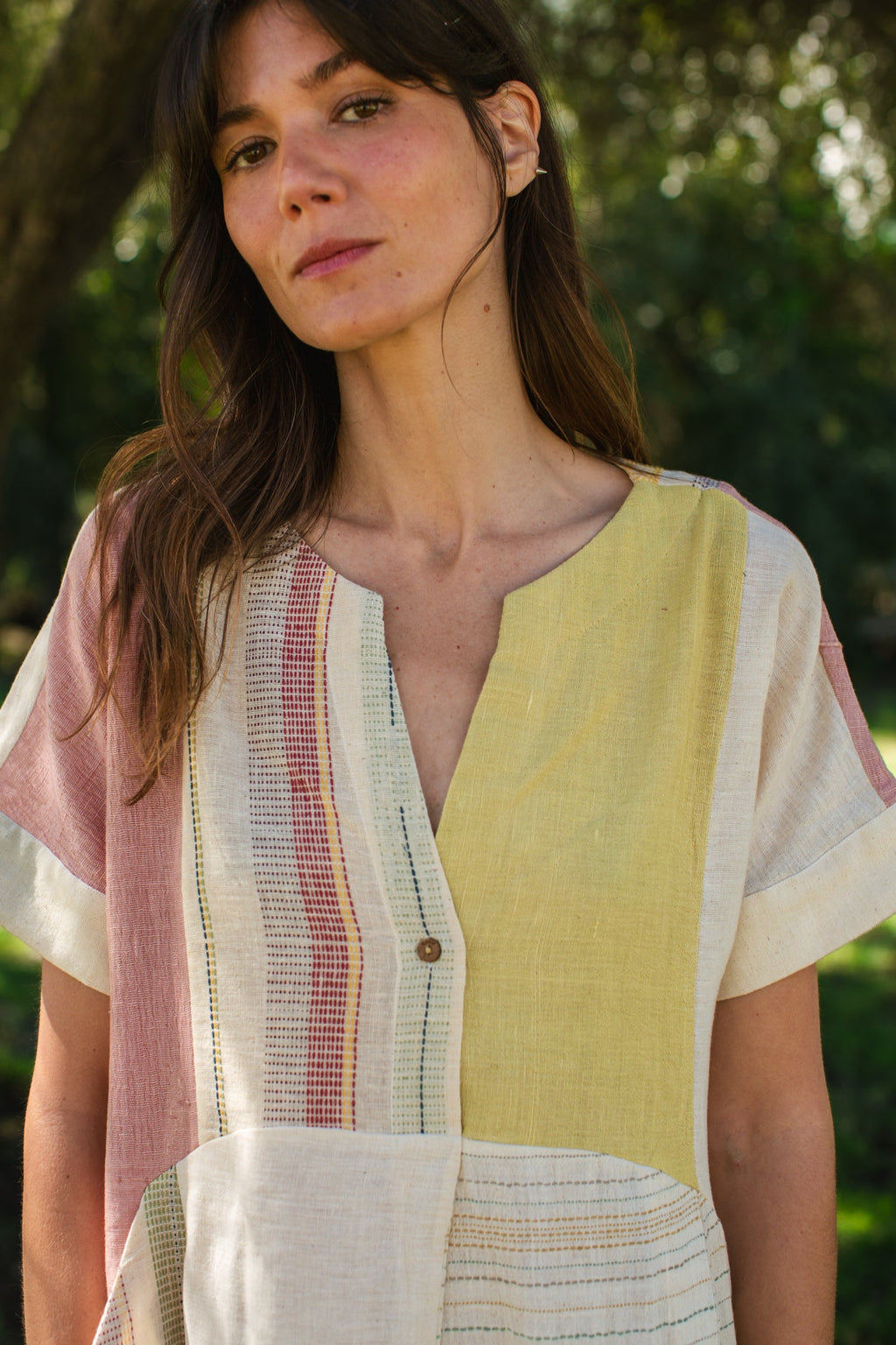 This dress is made in collaboration between Erica Kim @ahistoryofarchitecture and World of Crow, This dress has woven patches of different desert colors, it is made with handwoven fabric