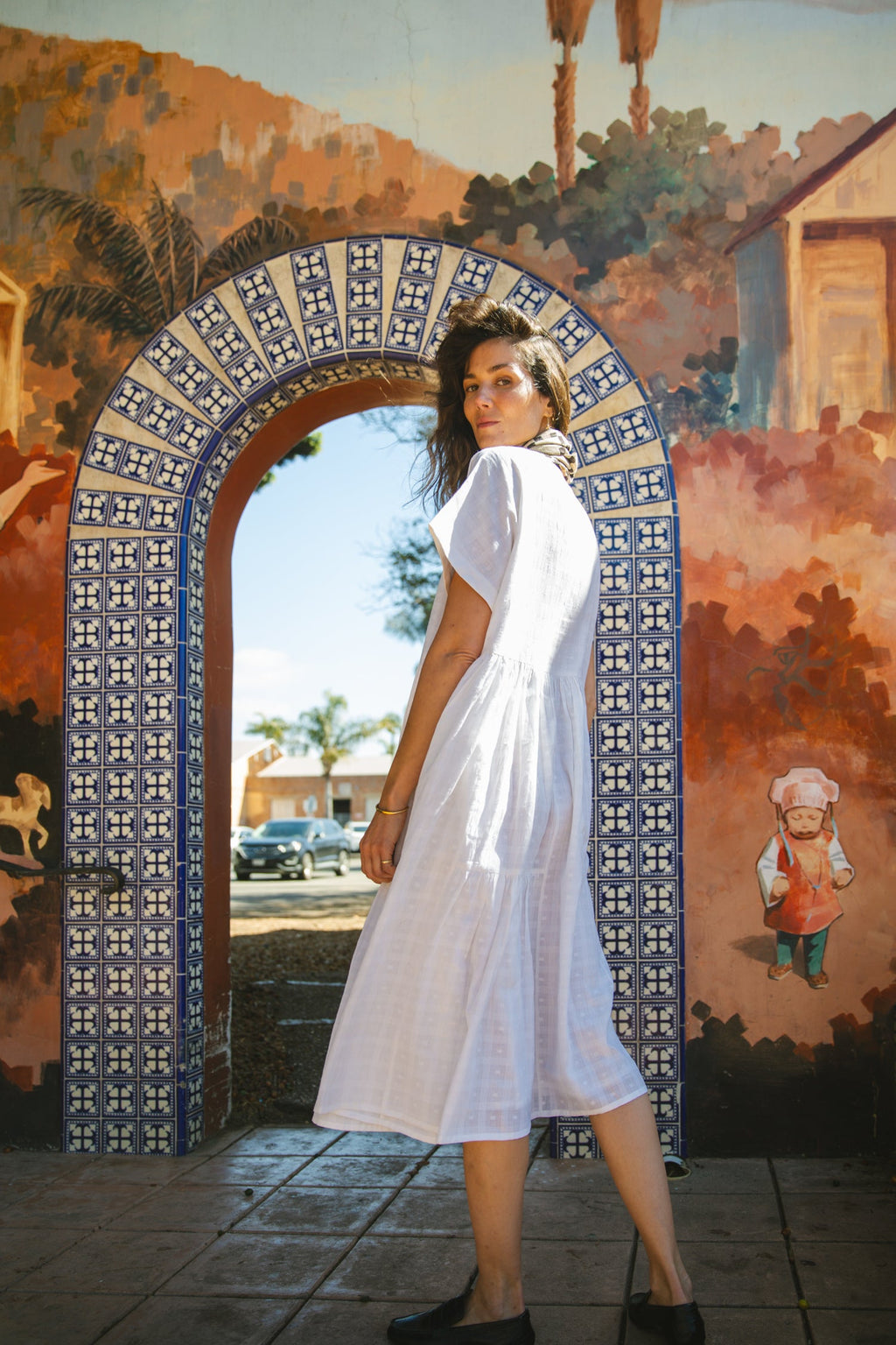 White A-line midi dress with cap sleeves, a button-down front, a gathered waist, it has delicate checks adding a texture to the garment. Made from lightweight, breathable fabric for a relaxed fit.