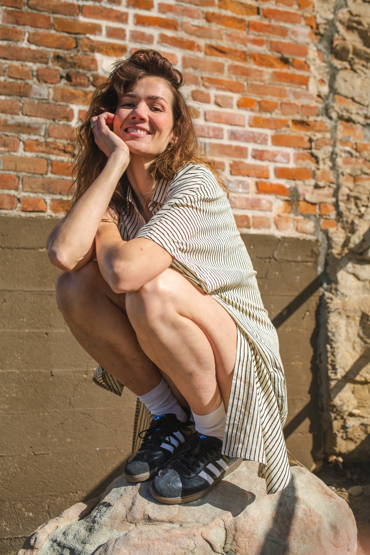 Black and white striped zebra-print shirt dress with a relaxed fit, lightweight breathable fabric, and subtle textured pattern for a stylish and comfortable look.